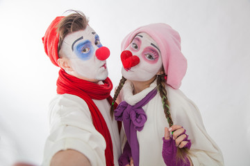 emotional mime guy and girl take pictures of themselves on the phone. Human emotions