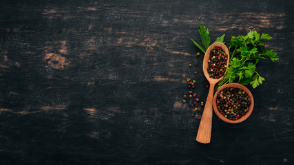 Green parsley and spices. On a wooden background. Top view. Copy space.