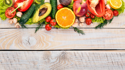 Healthy food. Vegetables and fruits On a white wooden background. Top view. Copy space.