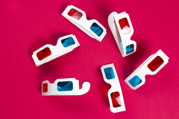 Paper 3d glasses on a pink background. film concept. Cinema in 3d