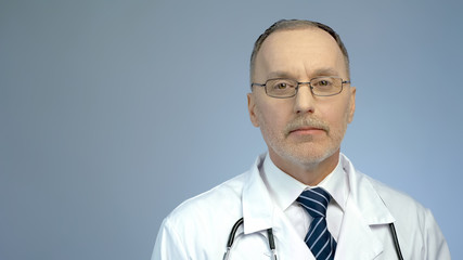Portrait of professional doctor posing for camera, quality clinic services