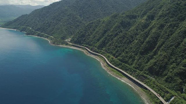 Aerial view of Patapat viaduct in the coast of Pagudpud, Ilocos Norte. Highway with bridge by coast sea near the mountains. Philippines, Luzon. Highway along the coast.