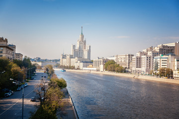 Beautiful city summer landscape, the capital of Russia Moscow, the embankment of the river in the city center, view of the skyscraper on Kotelnicheskaya