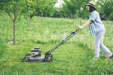 Young gardener mowing