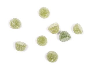 Green jelly, gummy sugar candies isolated on white background, top view