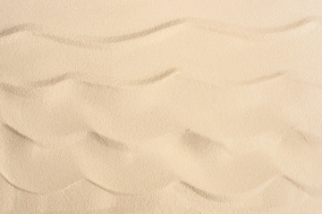 Wavy sandy beach texture for summer travel background