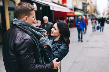 Fashion engagement shooting, photo session for beautiful couple, walk of a couple in love around the city and park.