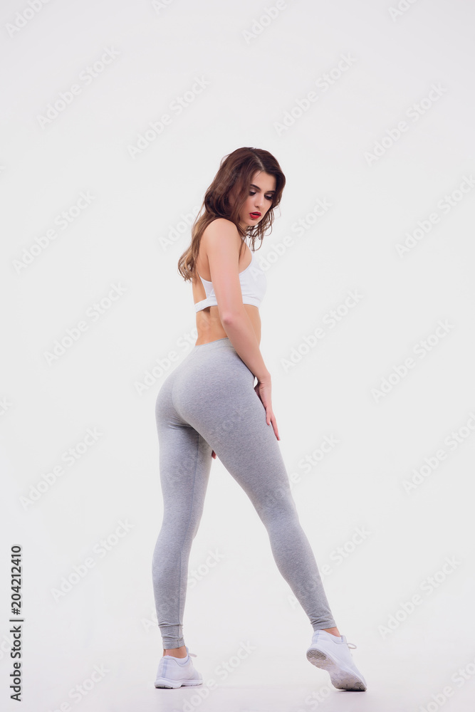 Wall mural Figure sports girl on white background