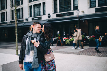 Fashion engagement shooting, photo session for beautiful couple, walk of a couple in love around the city and park.