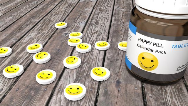 Happy pills, sad mood treatment monthly pack - round, white pills with a grinning, happy, yellow smiley emoticon that symbolizes a pill that everybody wants.