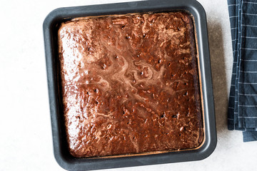 Square Juicy Chocolate Sponge Cake with Sauce in Mold.