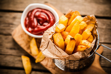 French fries on wooden table