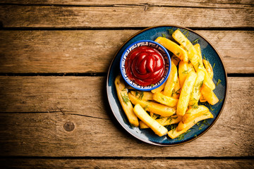 French fries on wooden table