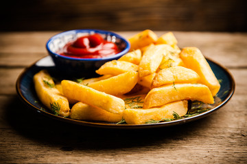French fries on wooden table