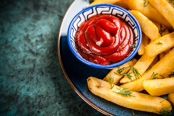 French fries on wooden table