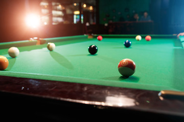 Billiard balls on the billiard table, American billiards. Sports games, outdoor activities.