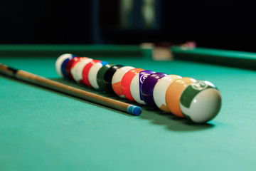 Billiard balls are lined up on a billiard table, American billiards. Sports games, outdoor activities.