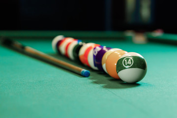 Billiard balls are lined up on a billiard table, American billiards. Sports games, outdoor activities.