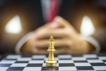 Businessman play with chess game. concept of business strategy and tactic