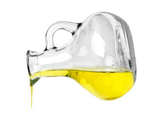 oil poured from bottle on white background