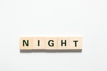 word inight  made of wooden block isolated on white background