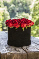 Beautiful bouquet of roses in a basket