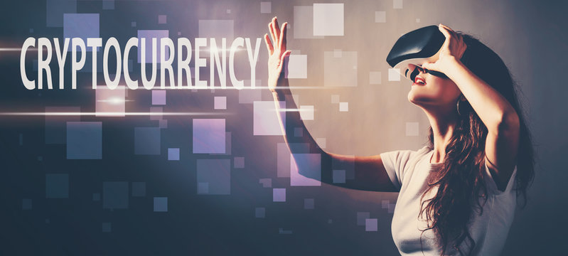 Cryptocurrency with young woman using a virtual reality headset