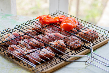 Marinated raw pork kebabs for summer barbecue party with vegetables