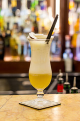 Colorfull cocktails with bar in the background