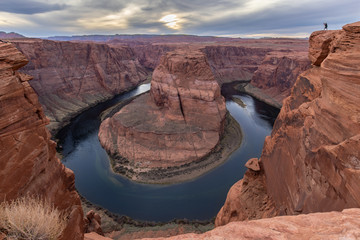 Tourist Photographs the Magnificent Horseshoe Bend in Page, Arizona at Sunset