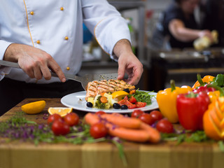 cook chef decorating garnishing prepared meal