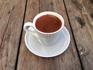 Traditional Taste of Turkish Coffee with a Wooden Table Background