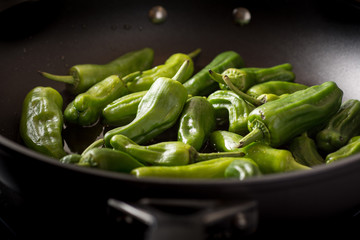 Green Padron Peppers Preparation in the Frying Pan - 204229603
