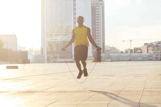 Fly. Boxer training before competitions. Holding jump rope.