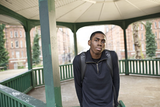 Portrait of a male student in a city
