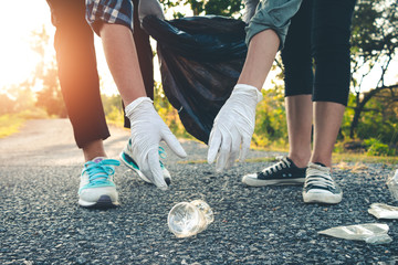 Women volunteer help garbage collection charity environment.