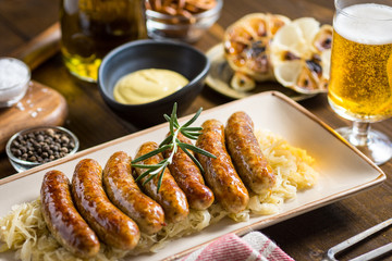 Homemade Pork Sausages with Cabbage, Mustard and Beer - obrazy, fototapety, plakaty