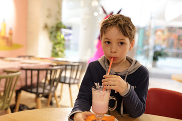 Boy has milkshake