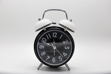 Closed up vintage analog clock isolated on white background.