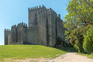 Naklejka premium Medieval castle in Guimaraes city, Norte region of Portugal.