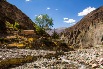 View of Iruya village and multicolored mountains in the surroundings at sunset, Salta province, Argentina, iruya - San Isidro - San Juan treeking