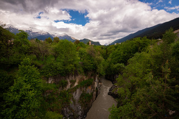 Fototapeta na wymiar Stormy mountain river in a narrow gorge