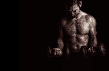 Fototapeta premium Powerful Man Lifts weight