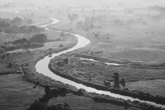 Artistic Foggy Black And White Sunrise Landscape From Above.