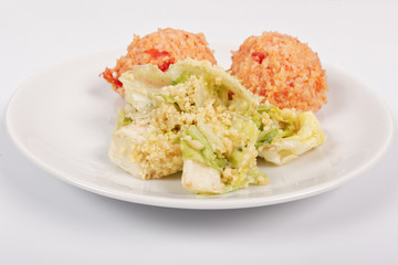 Tomato rice and salad on a white