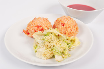 Tomato rice and salad on a white