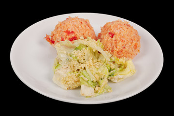 Tomato rice and salad on a black