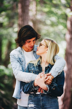 Beautiful young couple inlove standing in nature ambyent