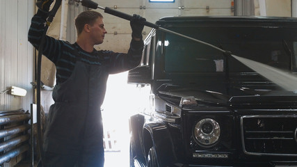 Washing a luxury car in the suds