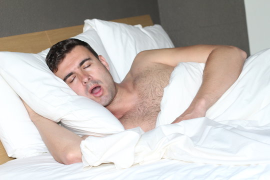 Funny man snoring in bed